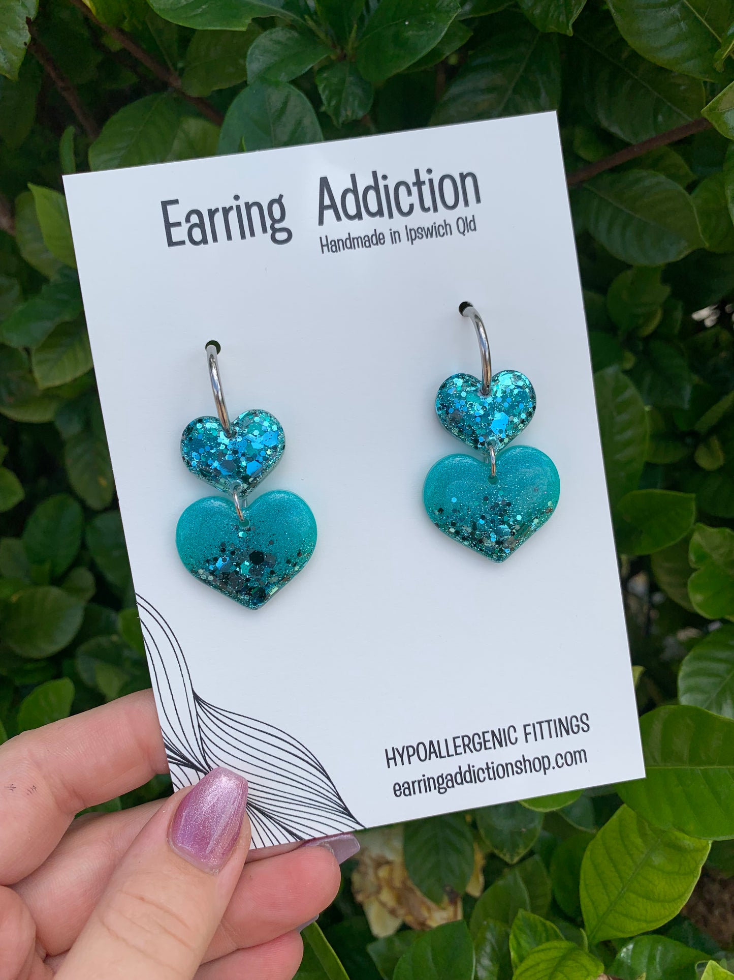 Turquoise glitter double heart huggy dangles