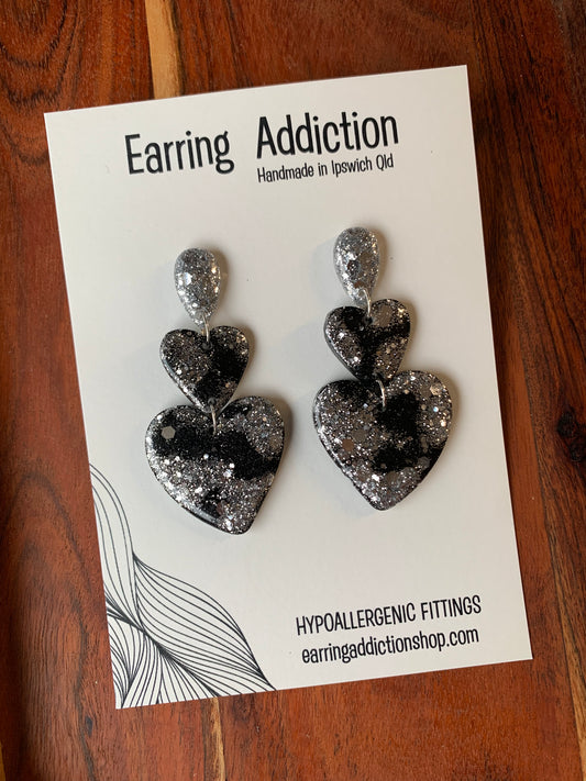 Black silver glitter double heart dangles